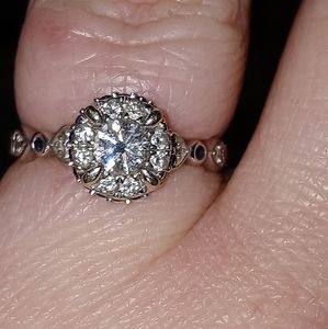 Diamond and sapphire halo engagement ring